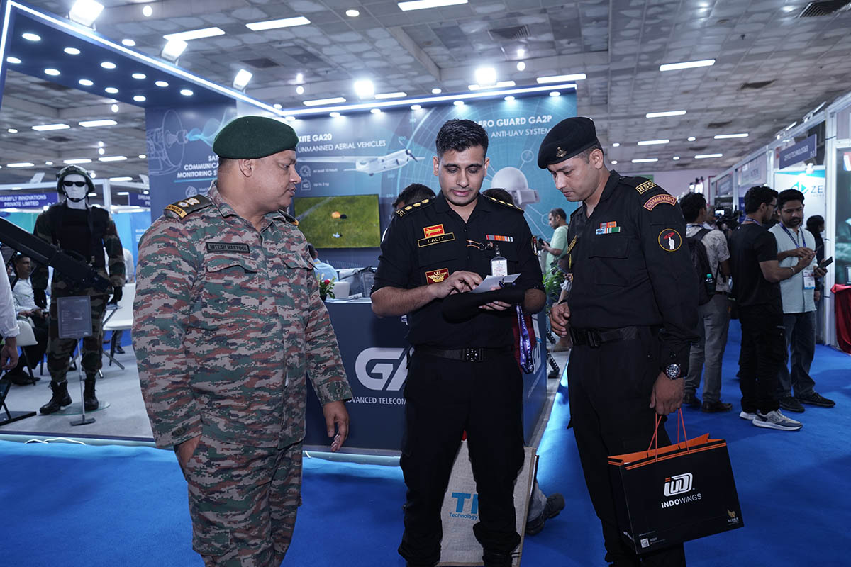 Defence personnel evaluating technology at the 2025 exhibition